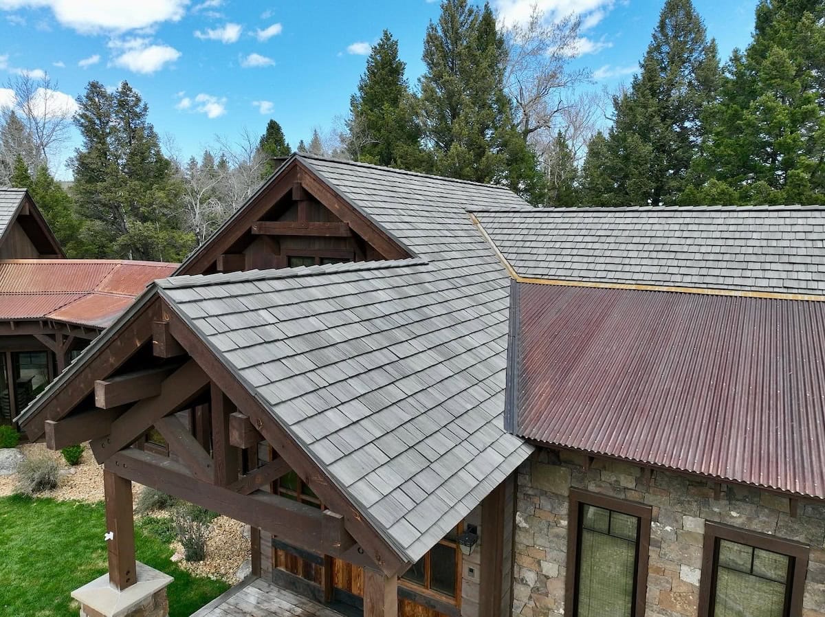 Composite cedar shake roof installed on large family home