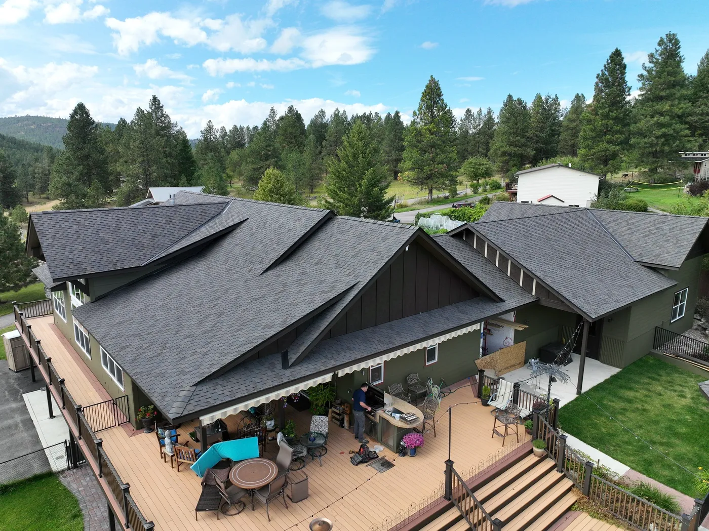 aerial view of dark asphalt shingles installed on kalispell mt home