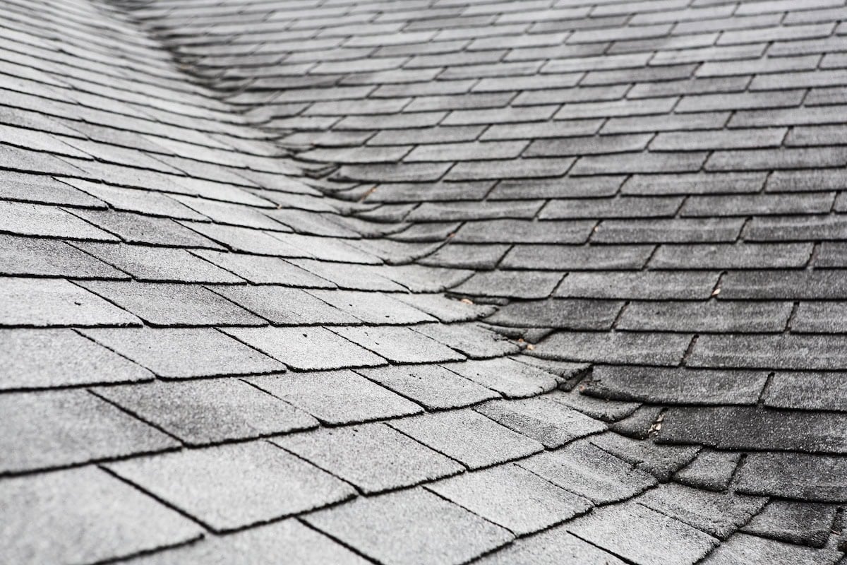 Old roofing buckling at the seam