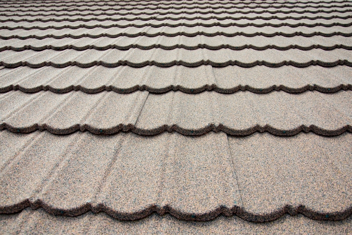 Composite brown roof tile background close up