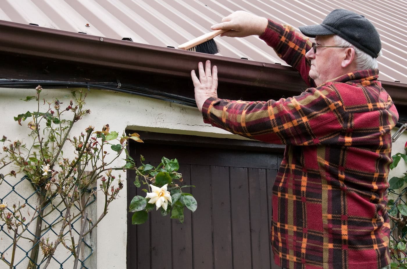 cleaning metal roof with brush
