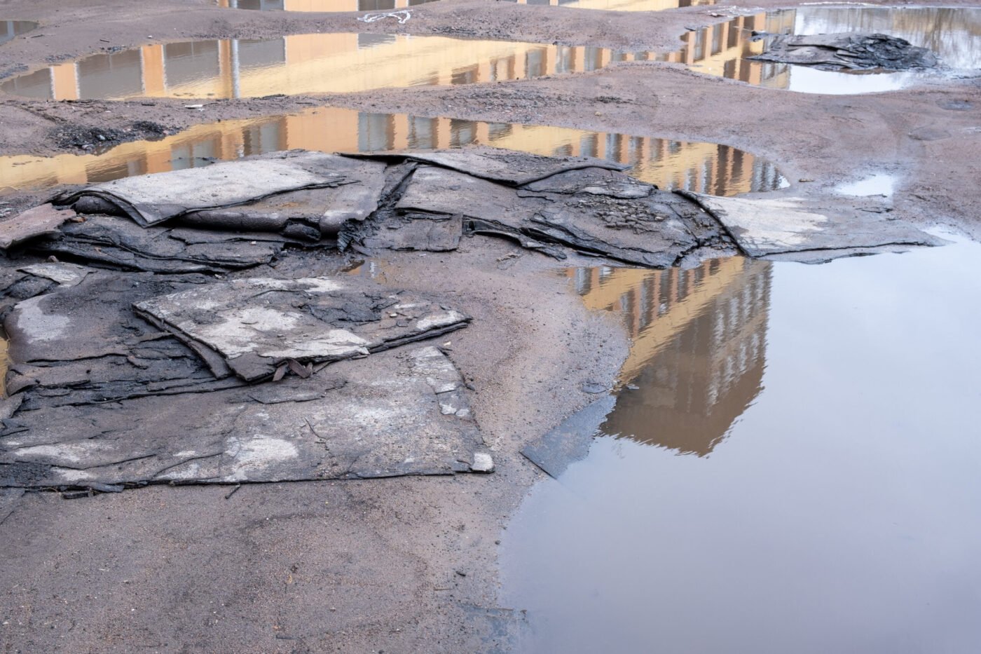 Sheets of old roofing at a construction site