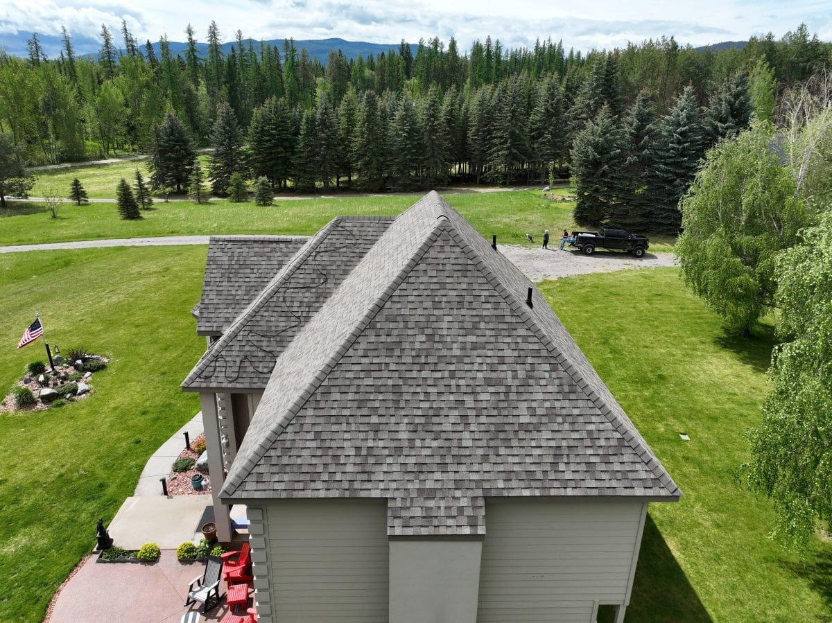 gaf shingle reviews Montana Roofing project grey big house surrounded by trees