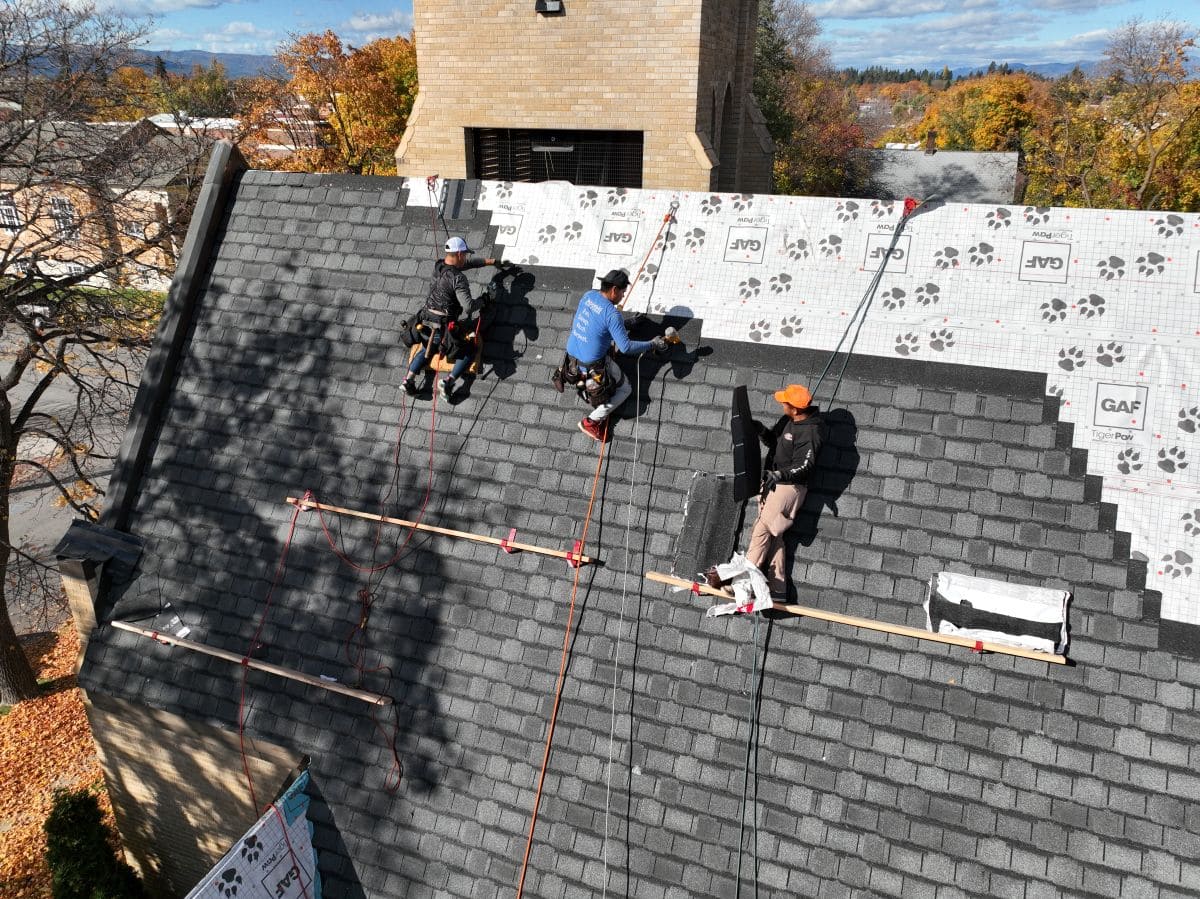 gaf shingle reviews Montana Roofing project workers replacing roof
