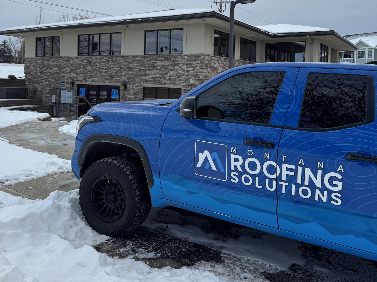 storm damage roof inspection Montana roofers branded truck