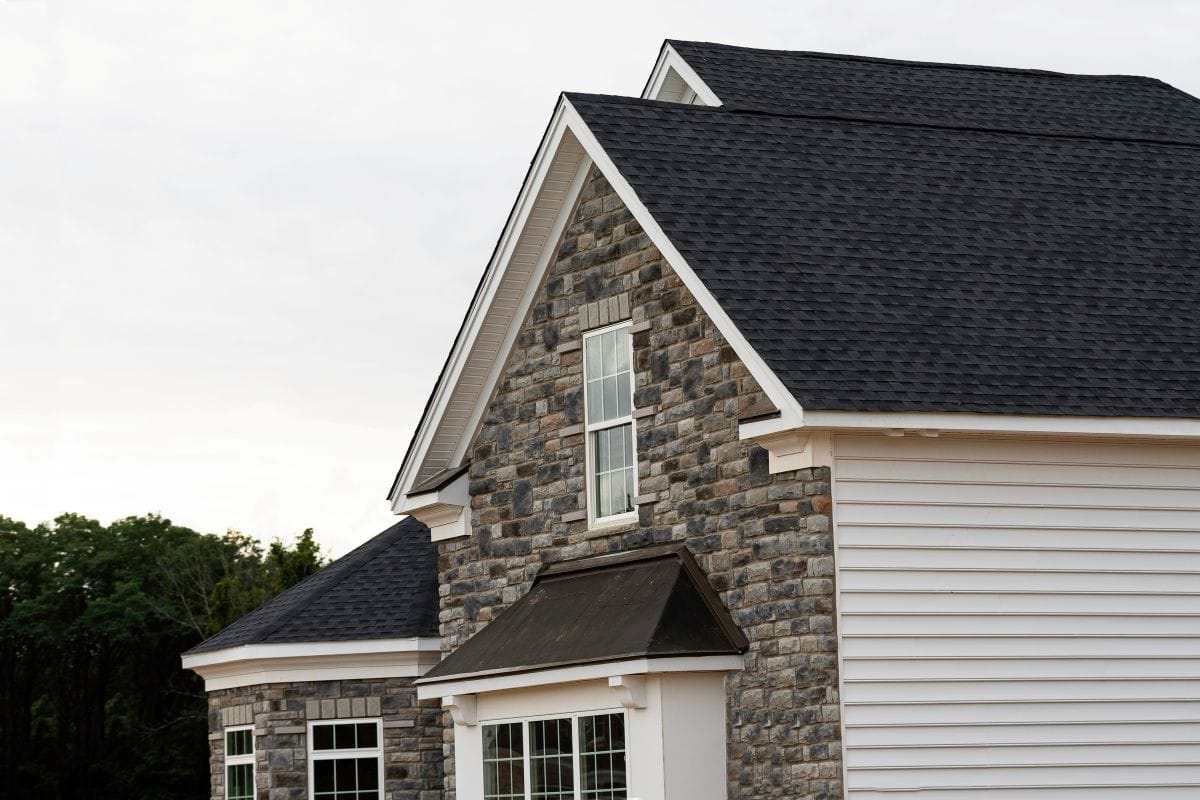 does a black roof make your house hotter dark shingles and stone wall