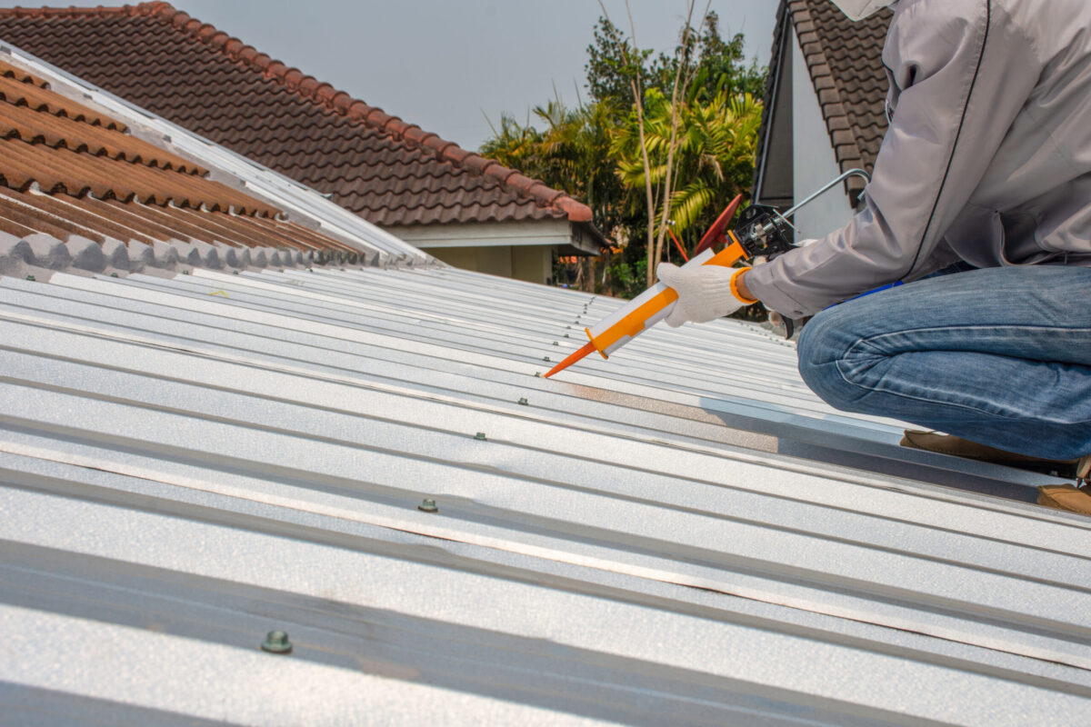 best roof sealant for leaks worker using sealant of metallic roof