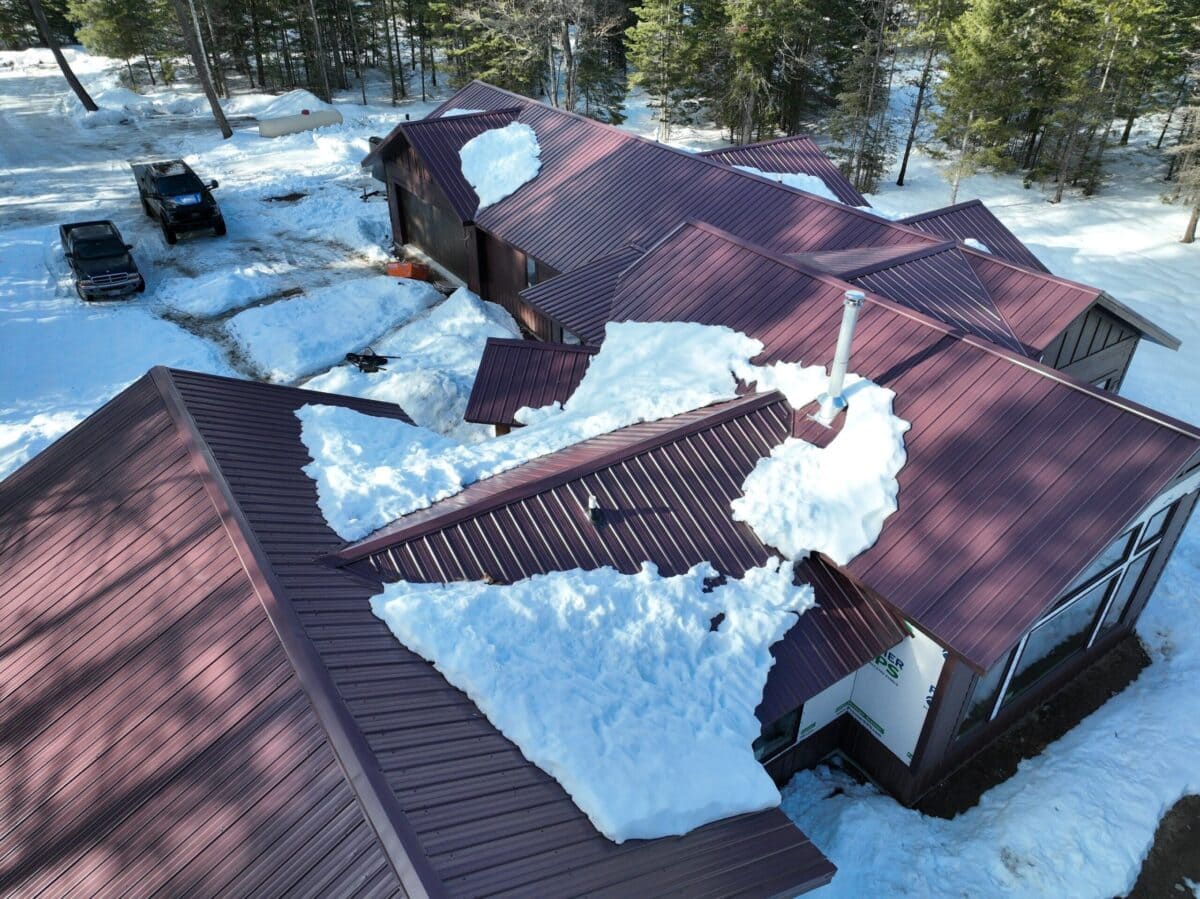 ice dam removal metallic roof full of snow